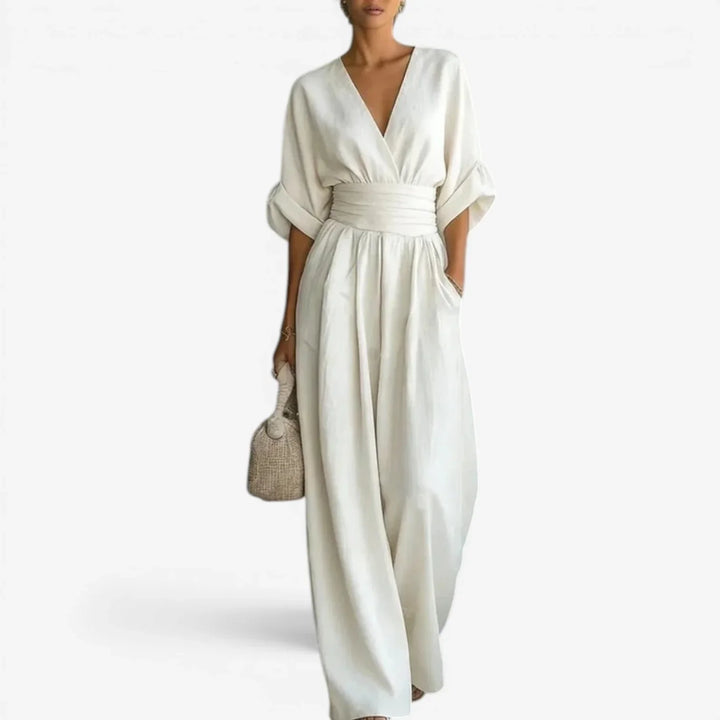 Close-up of kimono-style wide sleeves and deep V-neckline on light blue jumpsuit