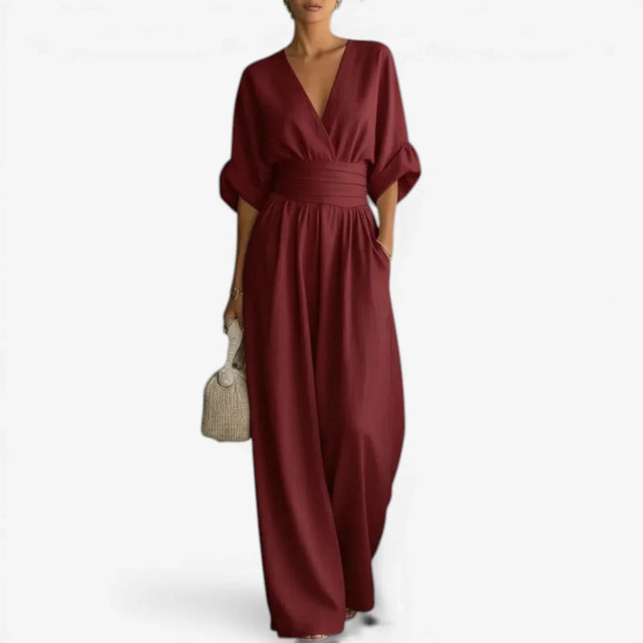 Full-length wide leg trousers with side pockets on V-neck jumpsuit