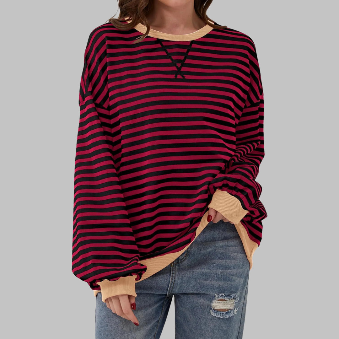 Close-up of soft knit fabric and bold horizontal stripes on women's casual sweatshirt