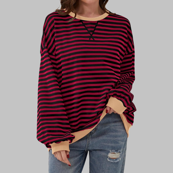 Close-up of soft knit fabric and bold horizontal stripes on women's casual sweatshirt