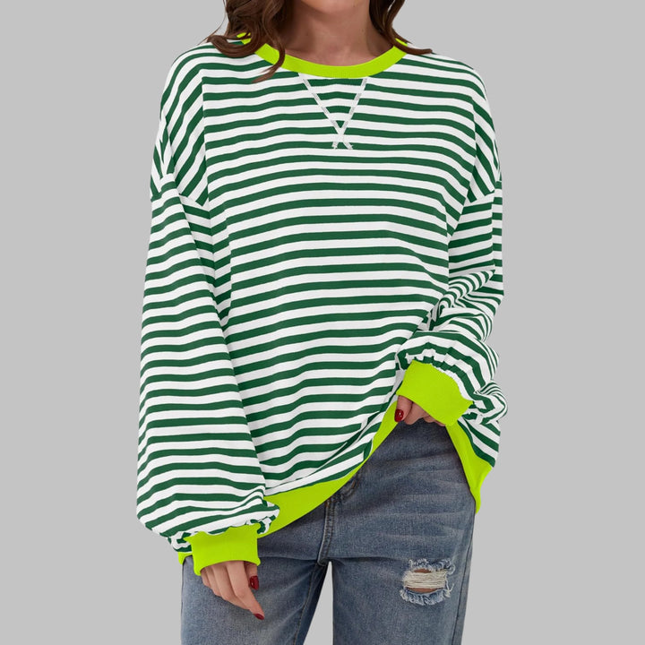 Close-up of contrast ribbed crew neck and sleeve cuffs on women's casual long sleeve striped sweatshirt