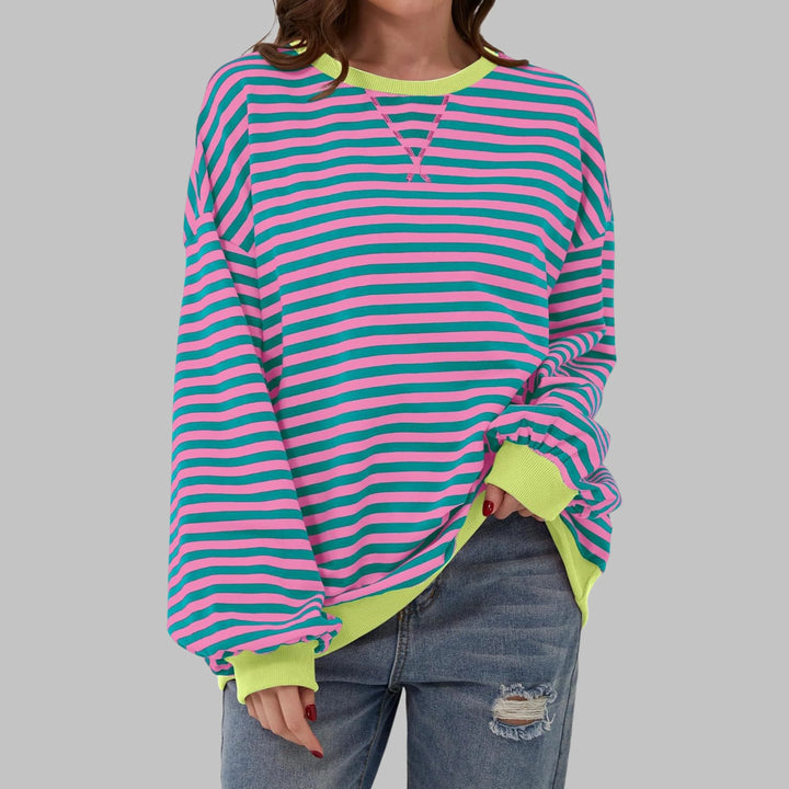 Detail of horizontal stripe pattern and knit fabric texture on women's long sleeve sweatshirt