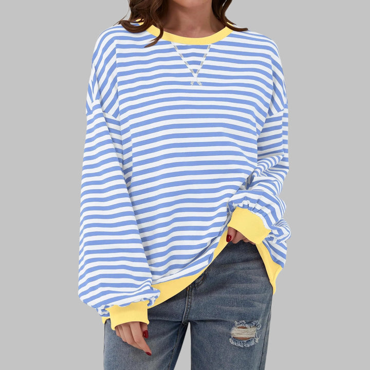 Back view of oversized striped sweatshirt showing relaxed drape and ribbed hem finish