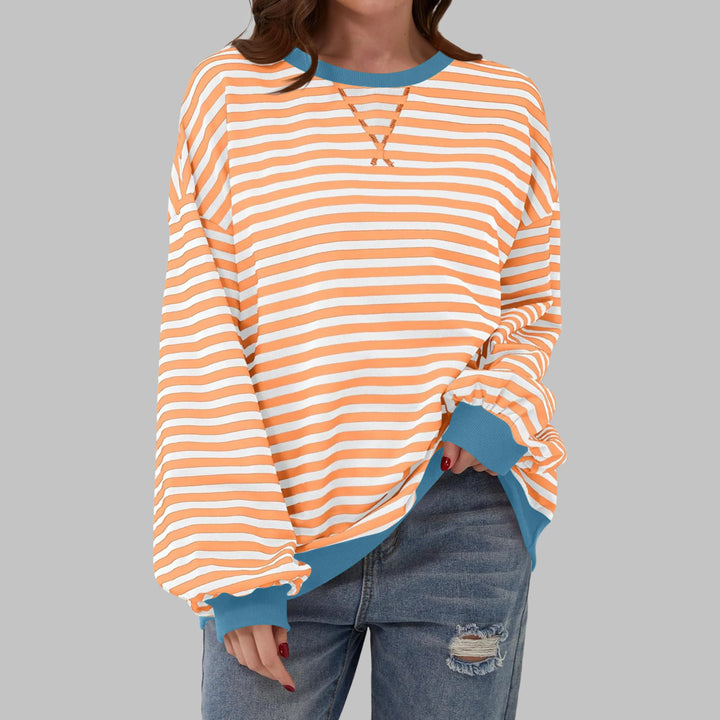 Women's casual long sleeve striped sweatshirt styled with high-waisted jeans for everyday comfort