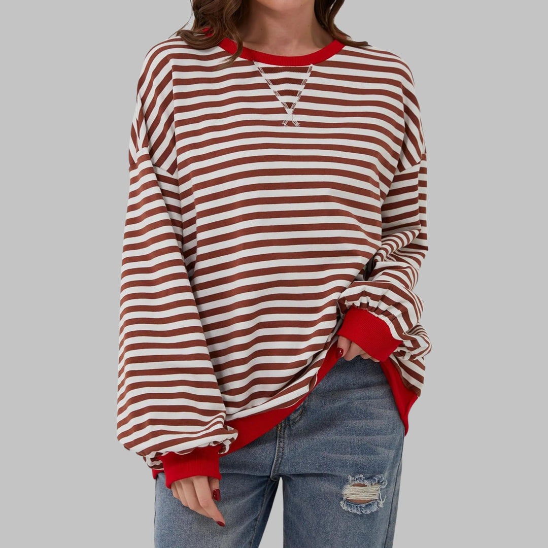 Three-quarter view highlighting dropped shoulders and comfortable stretch fabric of striped sweatshirt