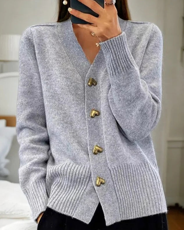 Women's heart button cardigan in grey with V-neckline and decorative heart-shaped button closure