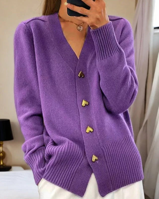 Side view of women's grey cardigan showing relaxed fit and full-length sleeves