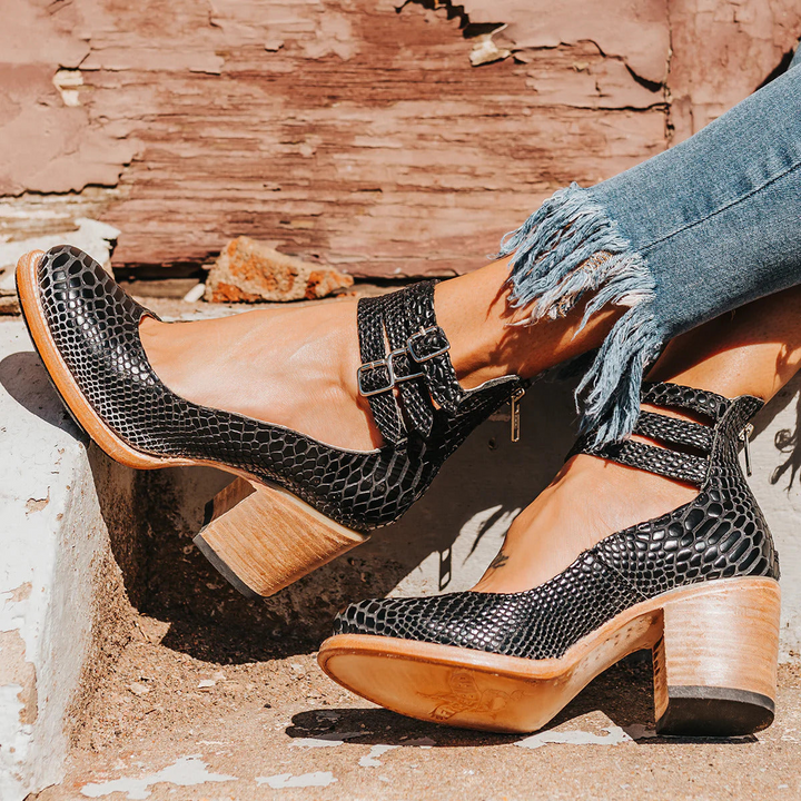 Front view of strappy ankle strap heels displaying smooth upper and adjustable double buckle closure