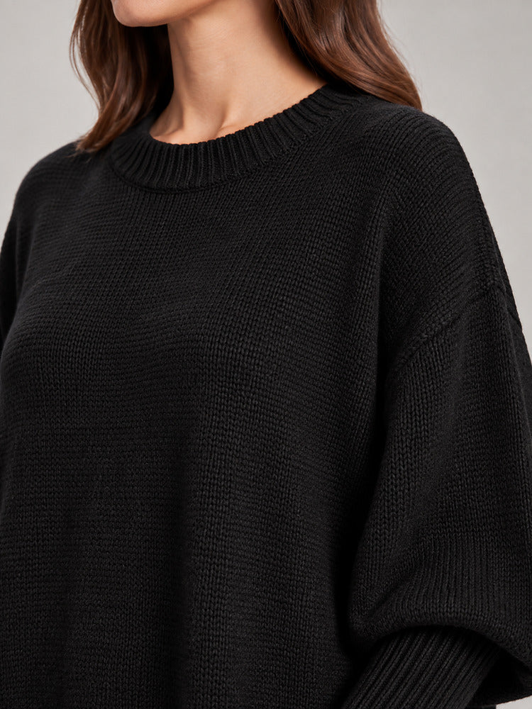 Women's chunky knit poncho jumper with an asymmetric hem