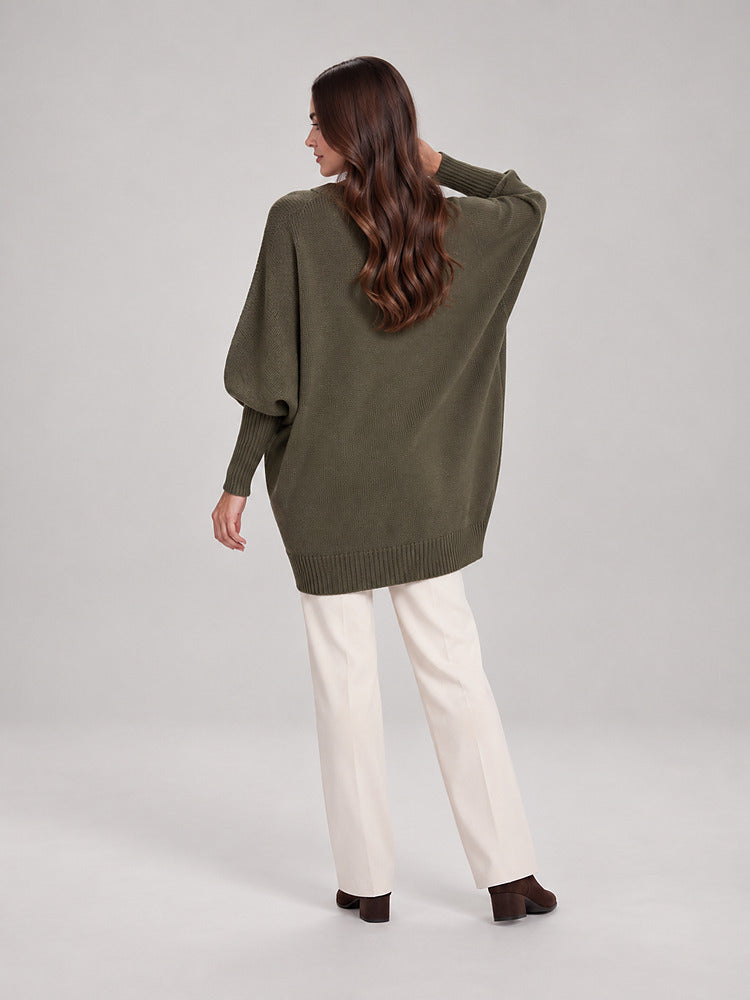 Women's chunky knit poncho jumper with an asymmetric hem