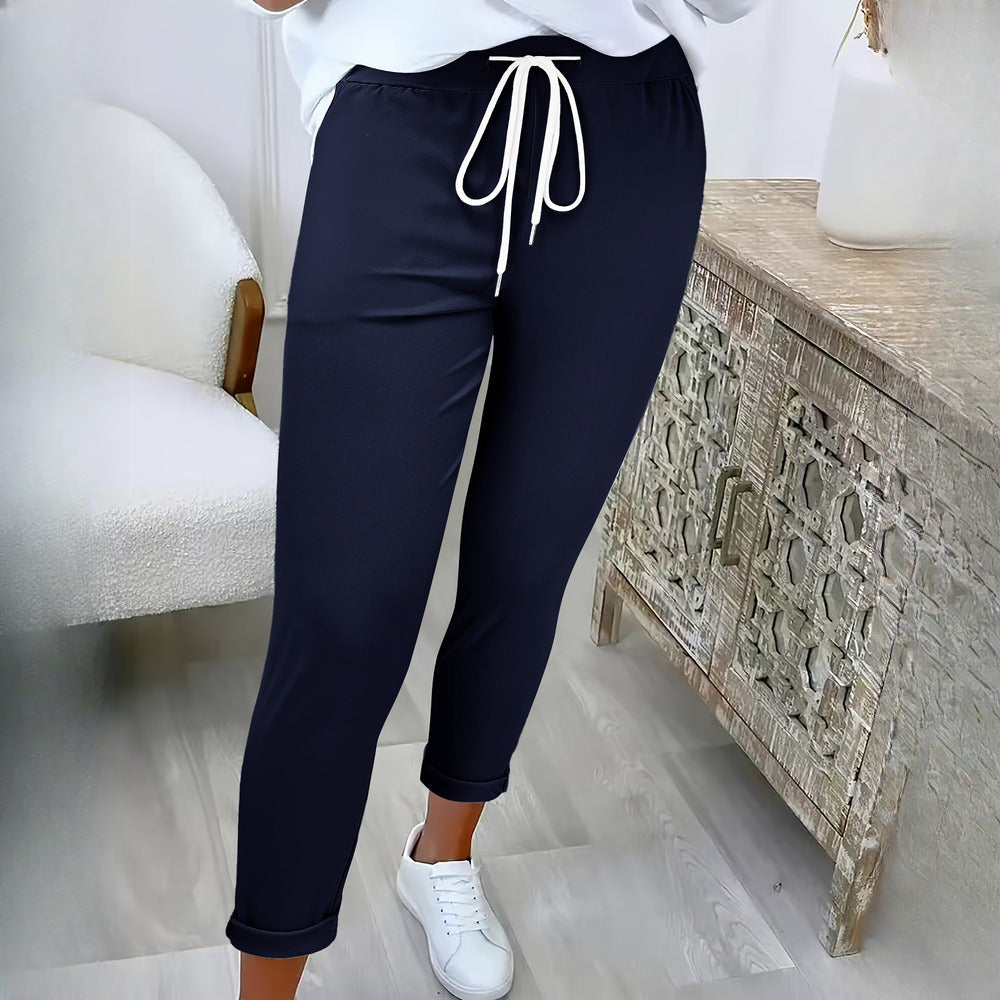 Women's drawstring tapered trousers in navy, worn on model