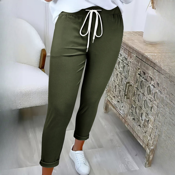 Women's drawstring tapered trousers in olive green, worn on model