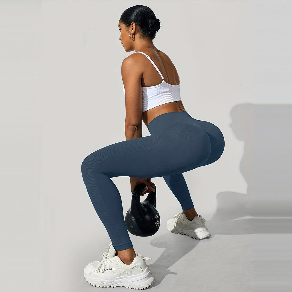 Women's high-waist shaping leggings in slate blue, worn on model