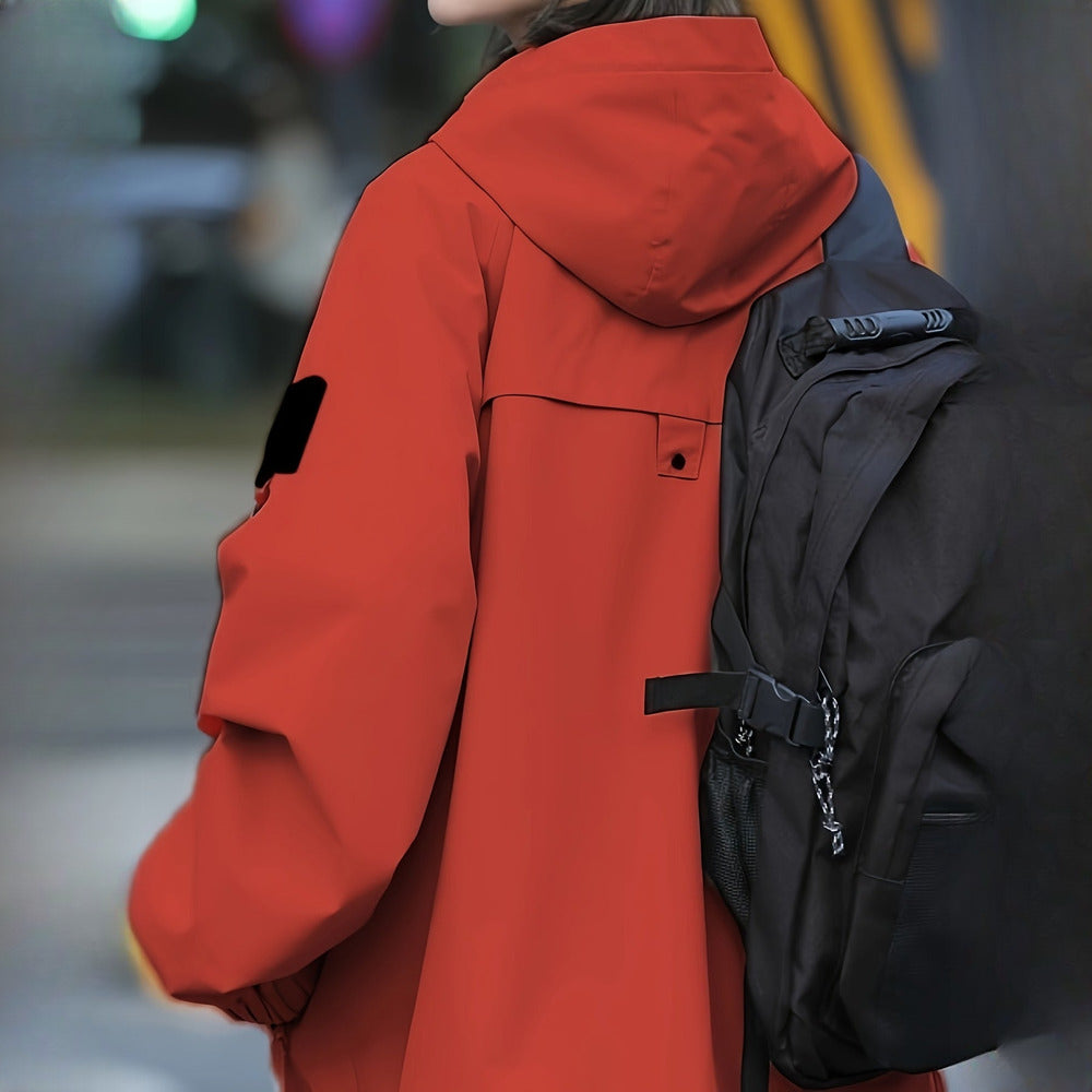 Women's windproof hooded mountain jacket in brick red, back view