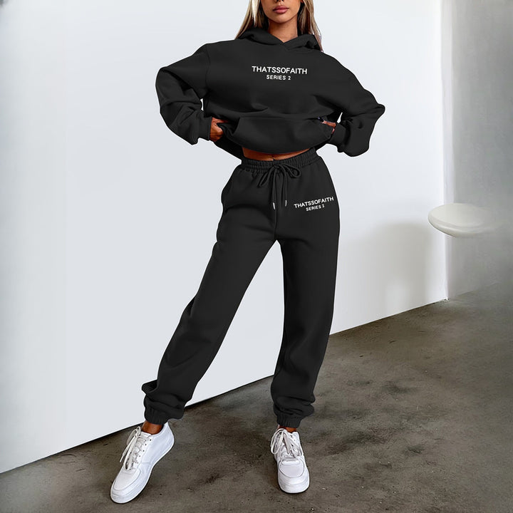 Women's hooded tracksuit set in black, worn on model