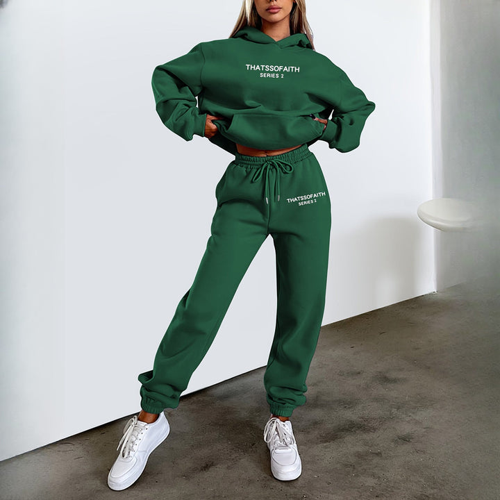 Women's hooded tracksuit set in dark green, worn on model