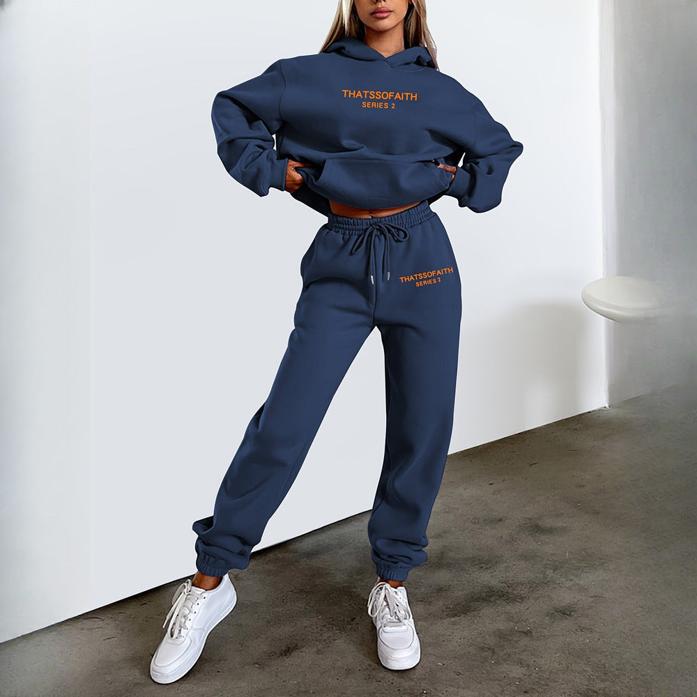 Women's hooded tracksuit set in navy, worn on model