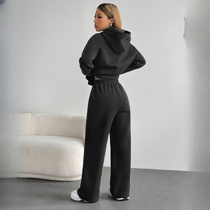 Women's hoodie and wide-leg trousers set in black, back view