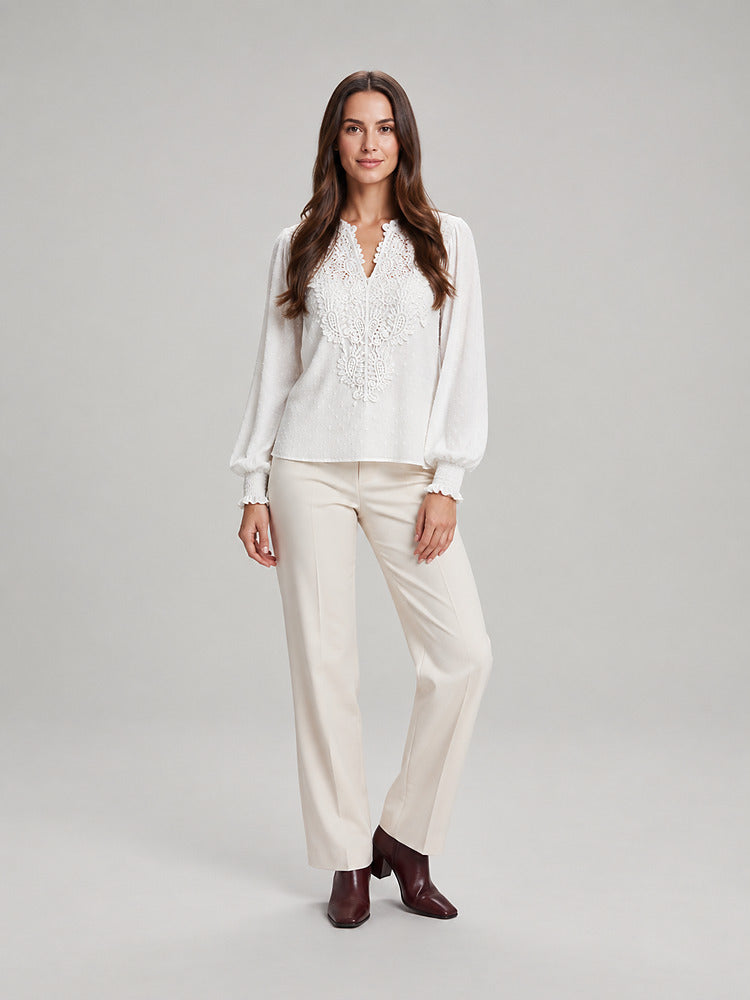 Women's blouse with an openwork front panel and long sleeves in white