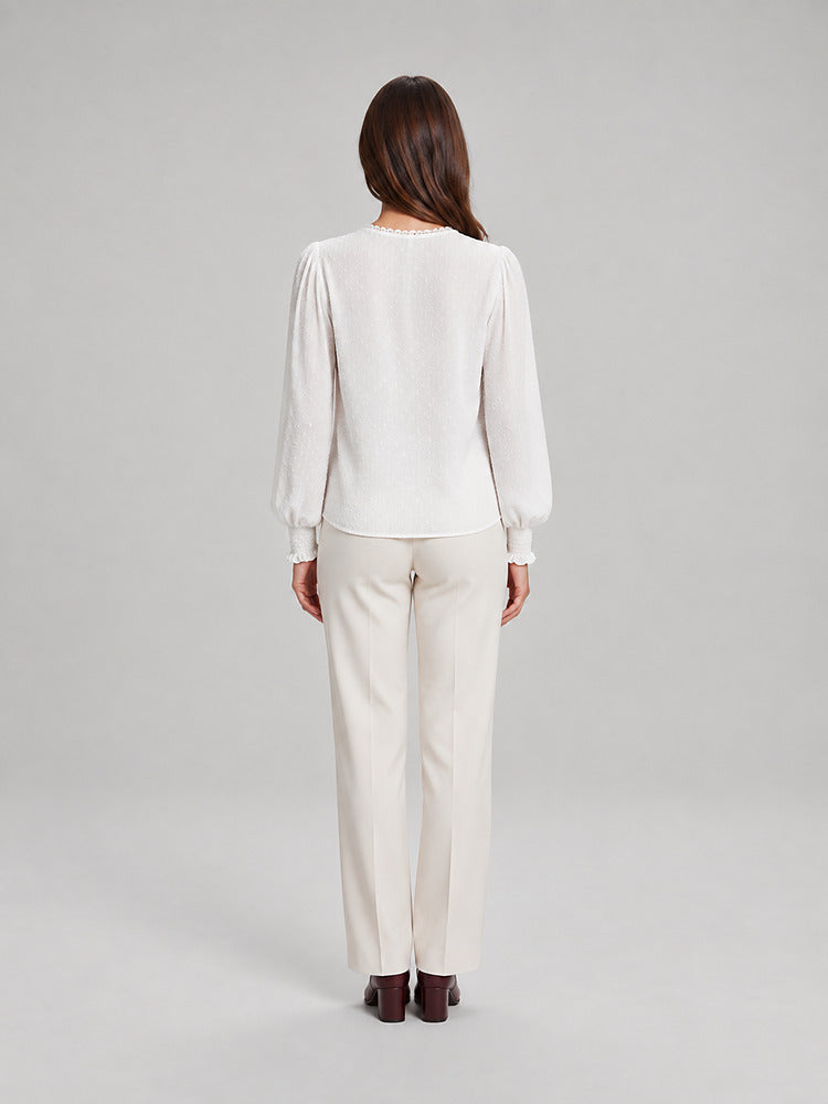Women's blouse with an openwork front panel and long sleeves