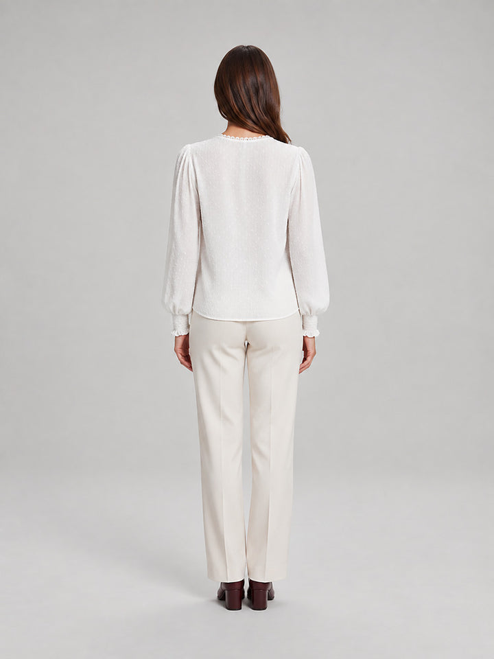 Women's blouse with an openwork front panel and long sleeves