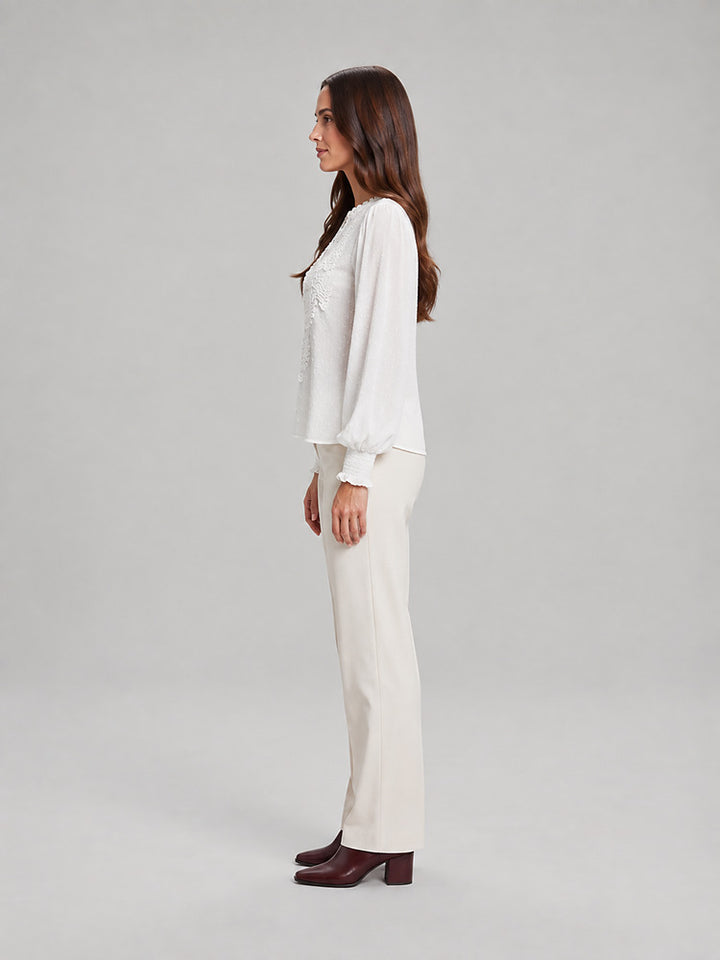 Women's blouse with an openwork front panel and long sleeves