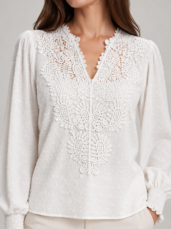 Women's blouse with an openwork front panel and long sleeves