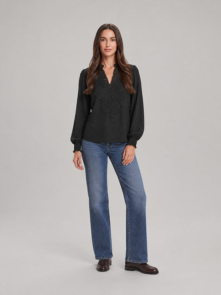 Women's blouse with an openwork front panel and long sleeves in black