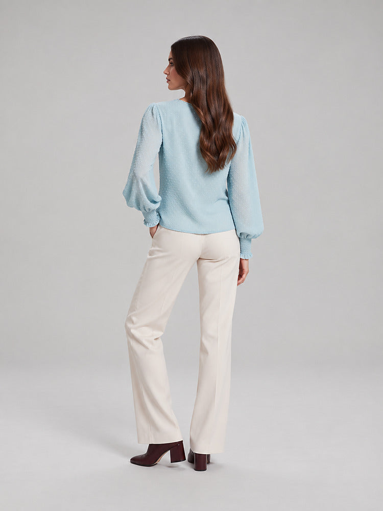 Women's blouse with an openwork front panel and long sleeves