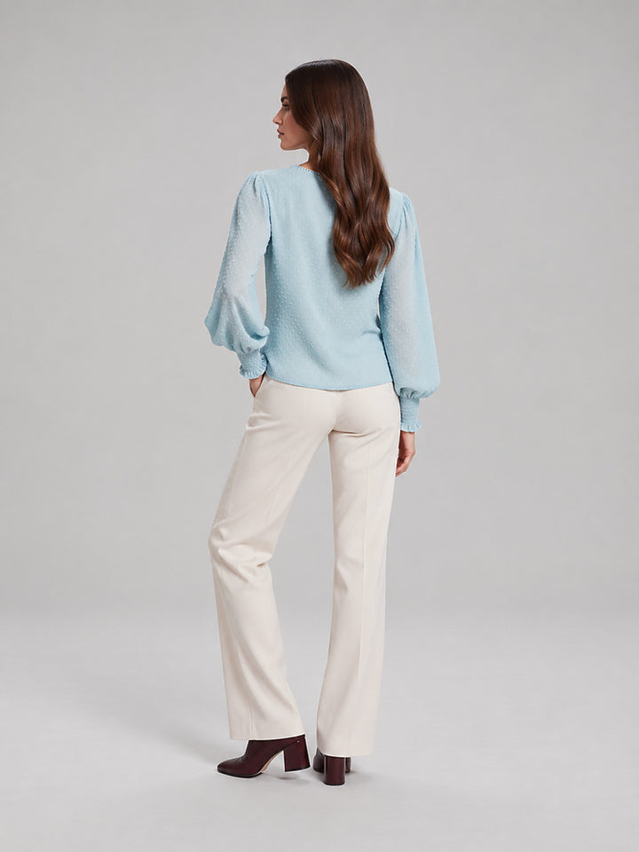 Women's blouse with an openwork front panel and long sleeves