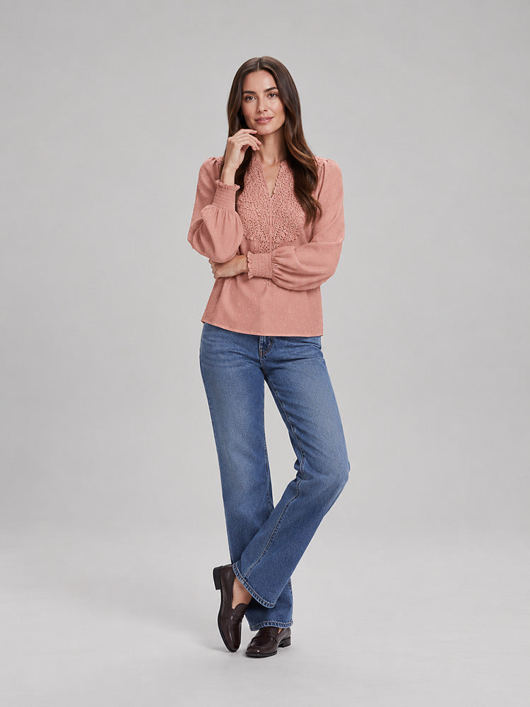 Women's blouse with an openwork front panel and long sleeves in pink