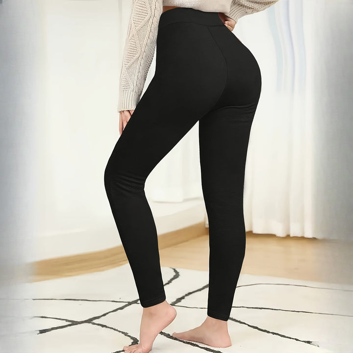 Women's plush-lined shaping leggings in black, side view