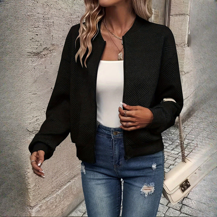 Women's textured zip-up jacket in black, front view