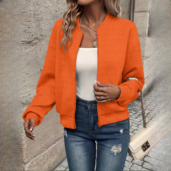 Women's textured zip-up jacket in orange, front view