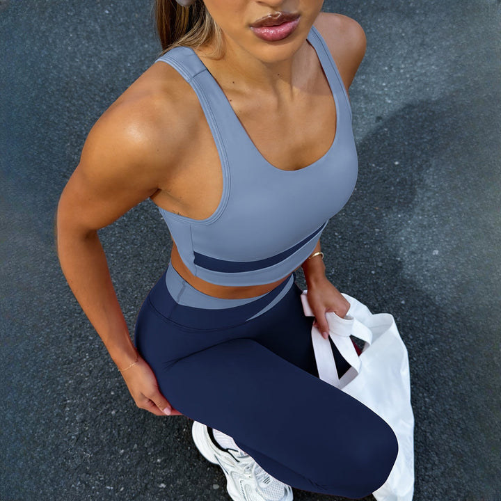 Women's two-piece activewear set in blue, side view