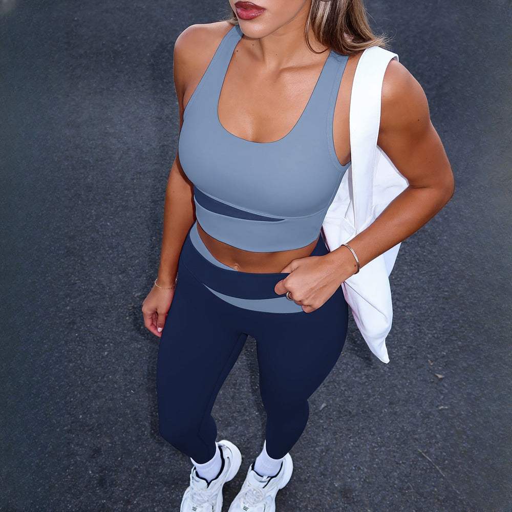 Women's two-piece activewear set in blue, worn on model